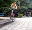 Олег на скамейке перед мозаичным КИТом